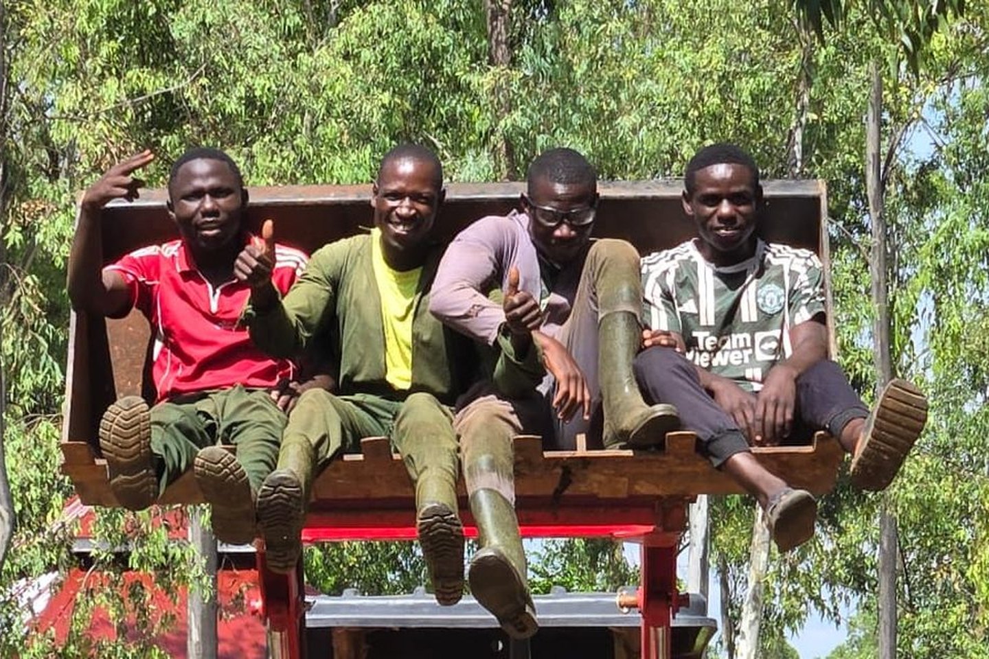 The New Life Farm team on the tractor loader
