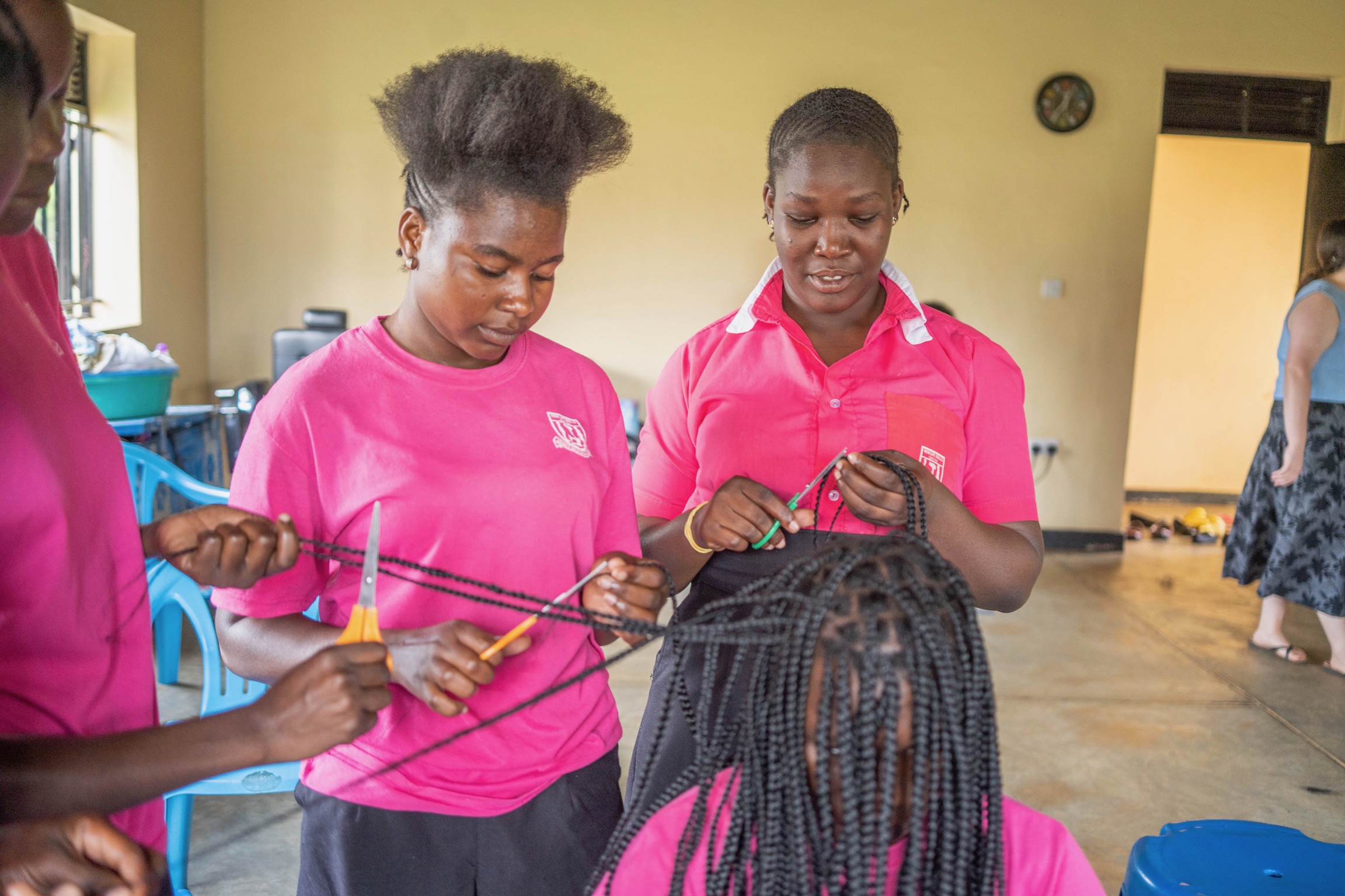 A student practicing hairdressing at the Girls Skills Center